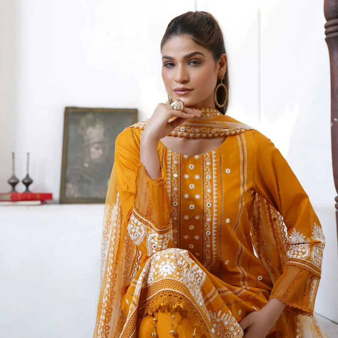 Bold Jhumka earrings paired with a high-neck kurta