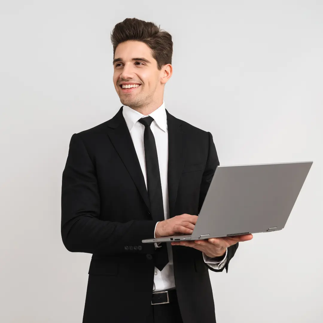 Man wearing a formal white dress shirt paired with a silk tie and navy suit