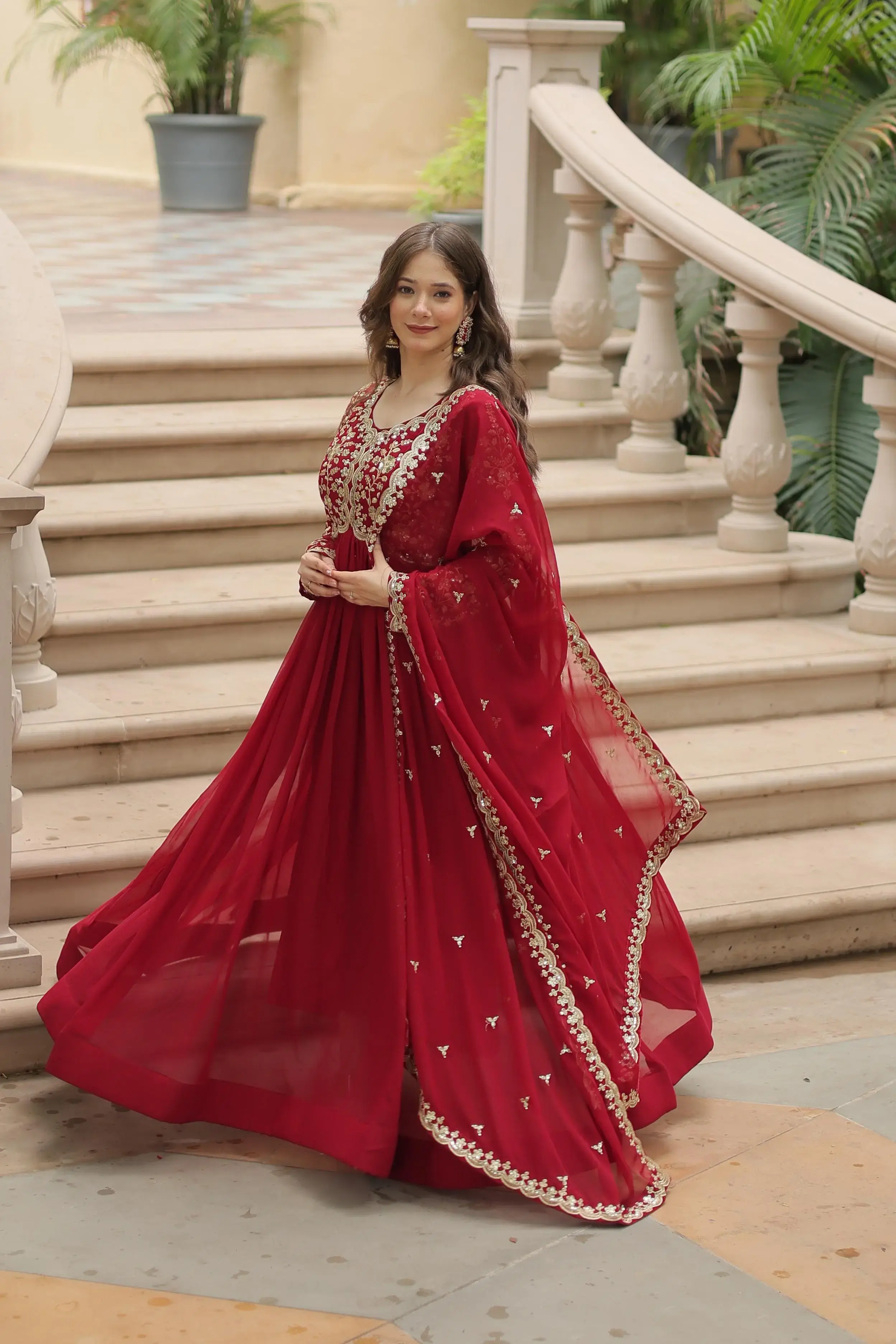 Bride spinning in a heavily embroidered lehenga under festive lights