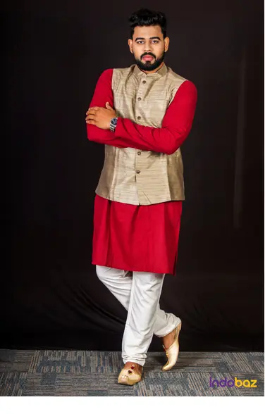 Man in embroidered kurta, churidar, and Nehru jacket