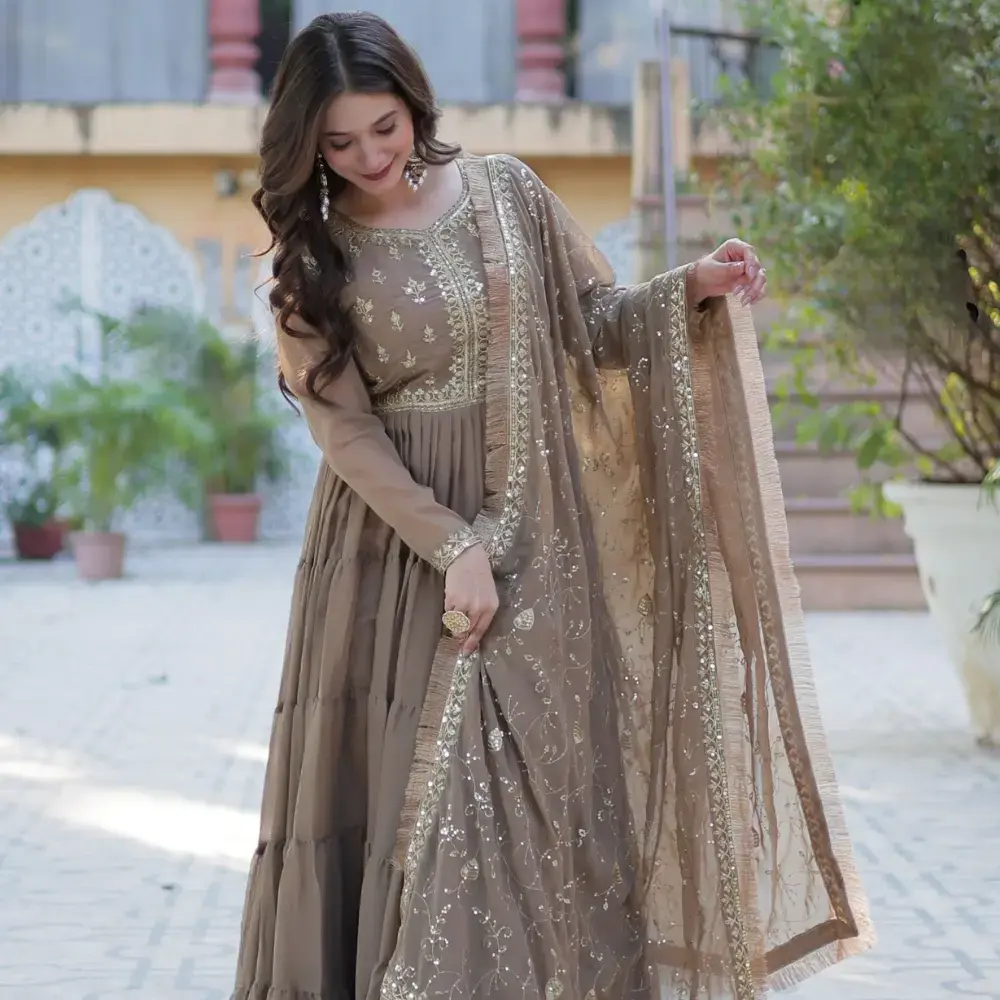 Model wearing contemporary georgette Anarkali suit with minimal embroidery